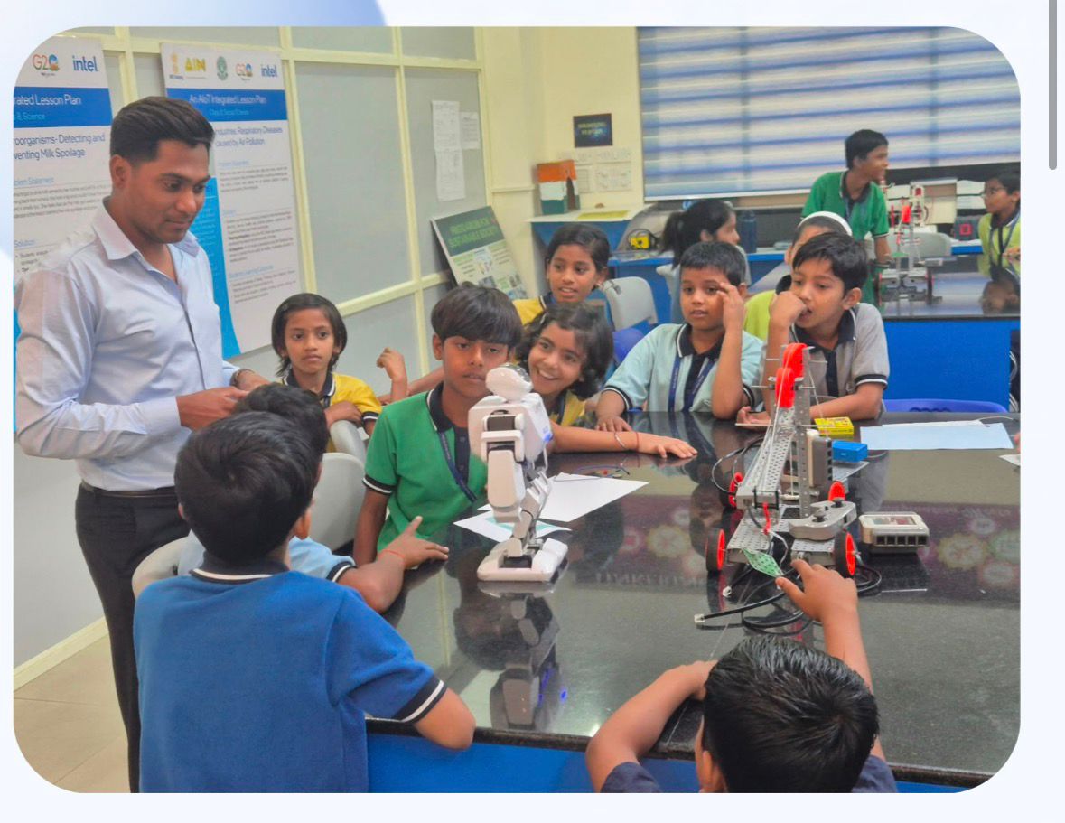 Students learning robotics with a mentor
